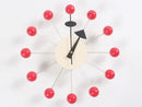 The modern European-style wall clock, named Clock, background wall, wall clock, features a beige circular center with sleek black hands. Metal rods ending in red balls reflect mid-century design flair, showing the time as 10:09 and making it an eye-catching piece for any interior decoration.