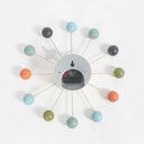 The Clock, background wall, wall clock showcases colorful spherical markers in blue, orange, green, black, and gray. Its open face design blends minimalist and artistic elements to elevate any rooms interior effortlessly.