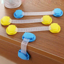 Four child safety locks are on a table, featuring a non-toxic design. Three locks with adjustable blue and yellow ends are neatly arranged, while one is secured to the edge to show its door lock safety feature, preventing children from opening doors. (Product: Door lock safety lock for childrens anti-opening door).