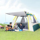 Three friends enjoy a sunny camping day beside their Automatic Tent Outdoor Camping Barbecue, one strumming a guitar while an open picnic basket with red and white cloth sits nearby. The tent’s waterproof design is showcased by the lush green grass and clear skies surrounding them.