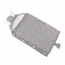 The Baby sleeping bag offers a cozy, gray knit design with a hood and cute bear ears. Made from cotton wool featuring a honeycomb pattern, it includes wooden side buttons and a luxurious lamb cashmere lining for added warmth.
