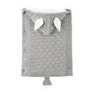 A gray knit baby sleeping bag, folded with elephant ears and tail, showcases a textured pattern and lamb cashmere lining for warmth, offering both comfort and a playful design.