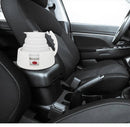 A white Car Folding Electric Heating Kettle 12V sits on the cars front passenger console, boasting a foldable design. Its interior includes black fabric seats and a gear shift, with the kettle featuring a prominent red power switch.