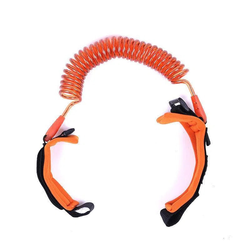 The Child Safety Wristband includes an orange coiled tether with anti-slip Velcro and adjustable black and orange straps for ankles or wrists, ensuring a secure connection. Its 360-degree rotation offers freedom while keeping children close.
