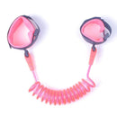 The Child Safety Wristband is coiled and pink with adjustable wristbands, featuring black-edged pink interiors and 360-degree free rotation. Its anti-slip velcro ensures a secure fit on both adult and child wrists, maintaining a safe connection.