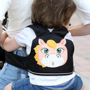 A toddler is safely secured in a Child Safety Rope motorcycle child safety belt within a front-facing cartoon horse carrier. The toddler, dressed in a white shirt, travels with an adult wearing denim shorts.