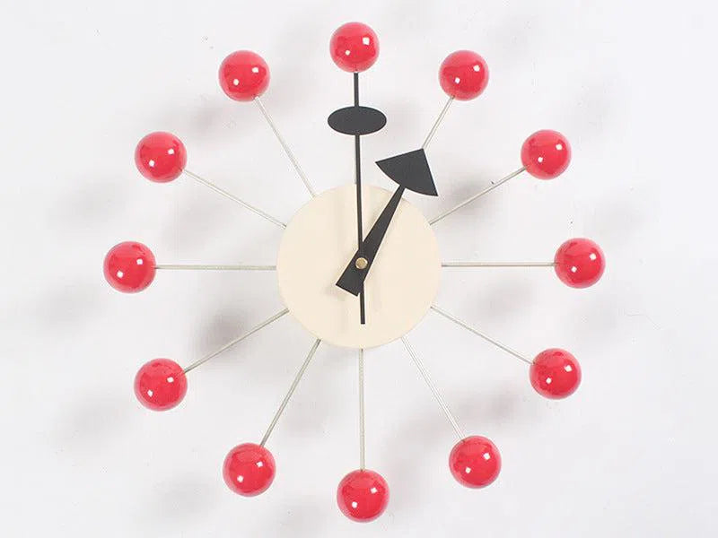 The modern European-style wall clock, named Clock, background wall, wall clock, features a beige circular center with sleek black hands. Metal rods ending in red balls reflect mid-century design flair, showing the time as 10:09 and making it an eye-catching piece for any interior decoration.