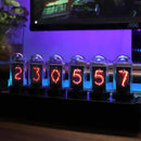 The Creative LED Electronic Digital Clock Solid Wood Nixie, featuring six vintage-style tubes, displays 230557 in a warm orange glow. It sits on a dark base amidst soft blue lighting and a computer monitor, merging classic Nixie design with modern aesthetics.