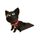 This Cute Cat Door Stopper is a black cat-shaped, punch-free doorstop with bright blue eyes and a red collar with a silver bell, designed in a sitting position with its tail laid back. It offers whimsical and functional anti-collision features for your door.