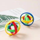 The Fingertip Gyro Creative Leisure Inertia Rotation, with red, yellow, green, and blue bands in interlocking rings, sits beside leaf-patterned paper reading Every moment matters. This vibrant gadget boosts hand-eye coordination and mindfulness daily.