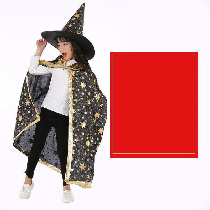 A child playfully embodies a magician in a Halloween Cloak Magician Role-playing Five-star Cloak Hat Set, standing beside a large red rectangle on a plain white background. The black witchs hat creates mysterious shadows over their white sweater and black pants.