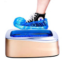 A person steps on the gold Household Simple Automatic Shoe Cover Machine, which automatically covers their sneaker with a blue cover. Its silver top showcases the advanced automatic mechanism.