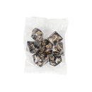 A small, transparent plastic bag contains the Innovative Fantasy Starry Sky Resin Multi-sided Game Dice, black with gold numbers, perfect for any fantasy adventure.