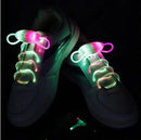 The Led Sport Shoe Laces Glow Shoe Strings feature fiber-optic technology, illuminating in vibrant pink, green, and white against a dark backdrop. These luminous shoelaces captivate attention with their striking night glow.