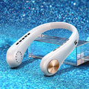 A sleek, white Mini Neck Fan Portable Bladeless Hanging Neck Rechargeable Air Cooler with gold accents is displayed on a transparent rectangular stand against a shimmering blue glitter background. This stylish neck fan features air vents along the inner curve and a convenient circular button on the end.