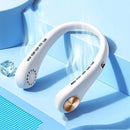 A white Mini Neck Fan Portable Bladeless Hanging Neck Rechargeable Air Cooler with gold-colored ends and vented arms sits on a light blue surface. Its cooling flow is emphasized by a nearby ice cube.