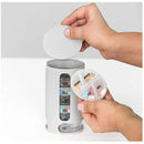 Hands holding a Mini Pill Storage Pill Box, a compact organizer labeled MORN and EVE, being removed from a cylindrical case with compartments for each day of the week, labeled MON to SAT.