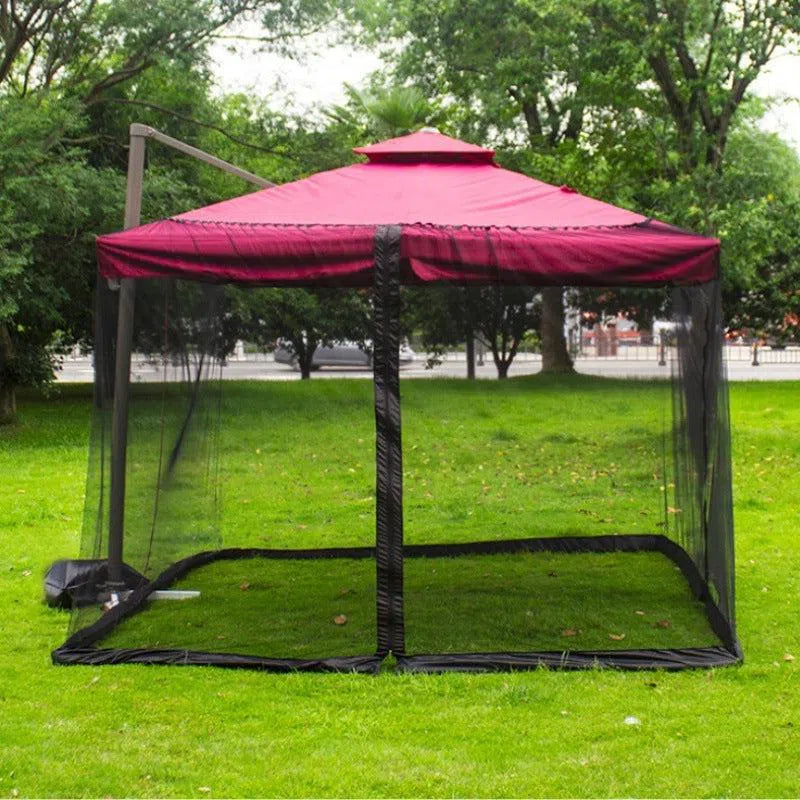 The Mosquito Net Outdoor Patio Umbrella Net Cover Roman Umbrella provides a relaxing retreat with its red-roofed gazebo and black mosquito netting, perfect for outdoor enjoyment. Its canopy enclosure, set amidst trees in a grassy area, creates serenity while a road in the background enhances the peaceful scene.