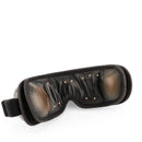 The New Eye Spa And Music Therapy offers a black eye mask with a soft, padded interior and small circular indentations. Its graphene-infused design includes an adjustable strap for comfort, providing a soothing experience ideal for relaxation or sleep.