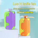 Two small, colorful rechargeable fans look like toy knives. One is green and purple, the other orange and yellow. Both have a top propeller. The text above reads Luo H knife fan, Radish Knife Mini-portable Handheld Fan, Collision color Fan.