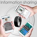Four hands hold smartphones surrounding the sleek Smart Ring Wearable Device Multifunctional Black High-tech. They show contact info, a website, and May I buy you a drink? The text above reads Information sharing, emphasizing this high-tech wearables data exchange capabilities.