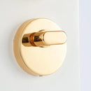 The Smart Door Lock Opens At A Touch features a sleek, gold-colored round knob and latch against a white surface. Its modern design reflects light, while integrated biometric technology ensures secure and convenient access with fingerprint storage.