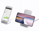 Two smartphones rest on wireless mobile phone chargers. The left screen shows a chat app in Chinese, and the right displays a calm seascape. These sleek, modern chargers provide fast charging with a Micro USB interface for efficient power delivery.